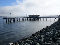 channel side fishing pier across street from the line of hotels