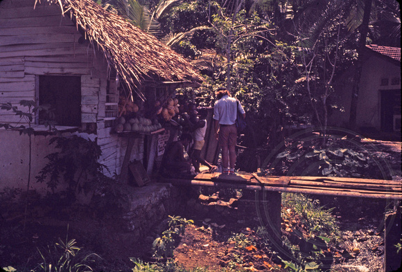 Kip buying coconut enroute to Kandy, Sri Lanka